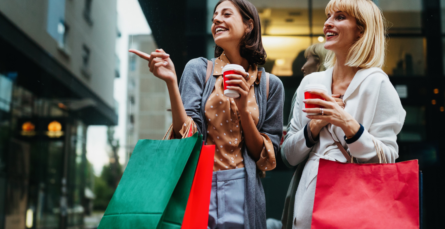 Beautiful Happy Women With Shopping Bags Walking A E5H6MDU